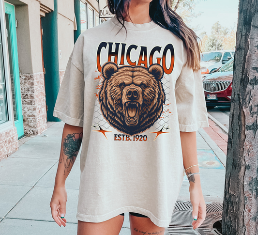 An ivory oversized Chicago football shirt with classic team logos, perfect for a fresh and casual fit.